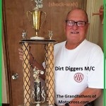 1974 a8 Nate Sciaqua holds National Sweepstakes Greenhorn trophy
